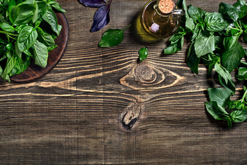Green fresh basil on wooden background. Top view