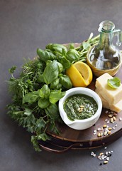     Pesto.Traditional italian homemade pesto dip. Dark concrete background. Selective focus
