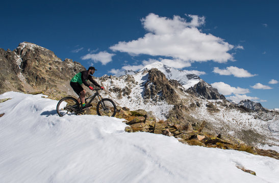 Cyclist riding on a mountain bike in the snow