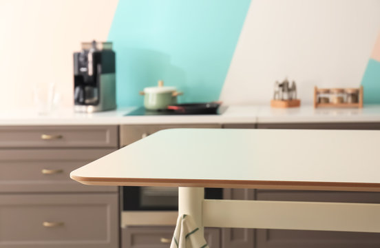 Stylish table in modern kitchen