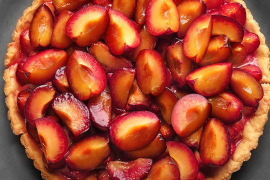Delicious pie with plums, closeup