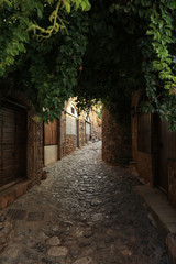 Beautiful street inside of the medieval castle town of Monemvasia, Peloponnese, Greece, June 2018.