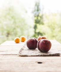 Nectarines, Peach and apricots on wooden table