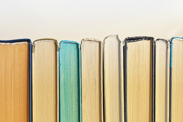 Background of multicolored books, toned.  Back to school concept.