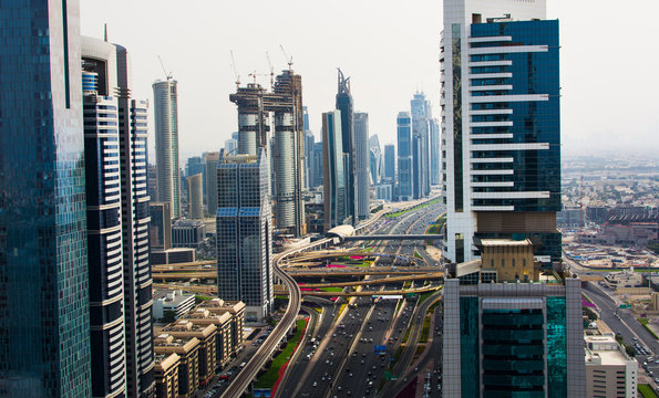 Dubai, United Arab Emirates - April 3, 2018: Busy sheik Zayed road surrounded by modern skyscrapers of downtown Dubai