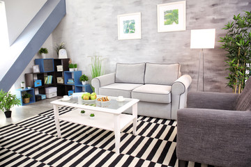Modern living room design with big striped carpet
