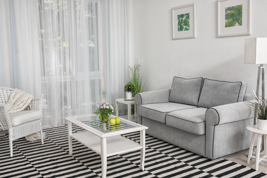 Modern living room design with big striped carpet