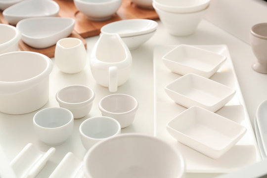 Set of ceramic tableware in kitchen drawer