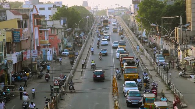 Traffic and pedestrians passing the bridge on chennai, India