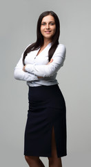 beautiful woman standing with her arms crossed,