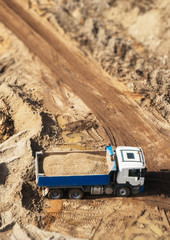 Truck with gravel on the construction site. View from above.