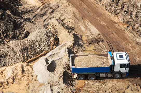 Truck with gravel on the construction site. View from above.