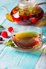 raspberry berry tea kettle cup fresh wooden
