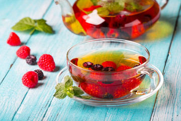 raspberry berry tea kettle cup fresh wooden
