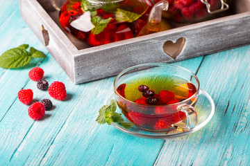 raspberry berry tea kettle cup fresh wooden
