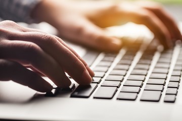 Woman working on laptop.