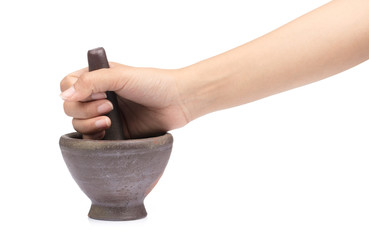 Mortar in a female hand isolated on white background
