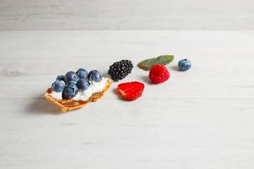 Cake with cream and blueberries