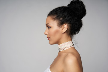 Beauty closeup profile portrait of beautiful mixed race caucasian - african american woman wearing...