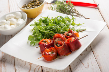 capsicum stuffed with mozzarella and capers with arugula salad