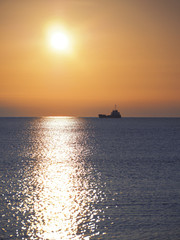 Ship at the sea during sunrise
