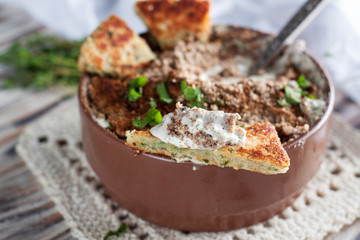 Hot spicy dip with jalapenos, cheese and herbs