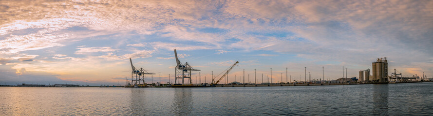 Fototapeta na wymiar quiet sunset in an unknown empty port panorama