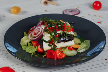 Salad for menus, vegetable salad with cheese. Composition on the table. Side view