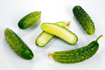 Green cucumbers bright and juicy shot on a white background