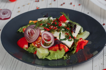 Salad for menus, vegetable salad with cheese. Composition on the table. Side view