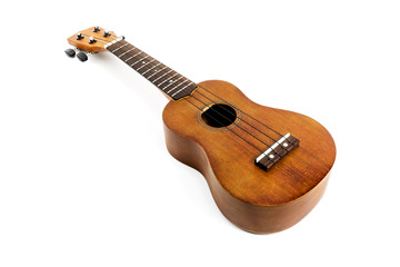 Fototapeta premium The brown ukulele on the white background,