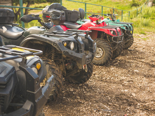 parked in a row several atv quad bikes extreme outdoor adventure concept
