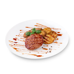 Grilled steak, baked potatoes, green basil and sauce on white plate