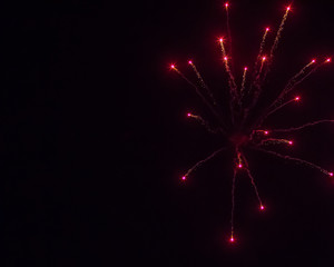 Red fireworks on black background