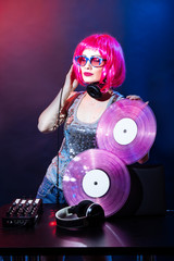Portrait dj headphone vinyl disk beach plays equipment summer disco girl party retro vintage pink...