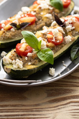 Zucchini boat filled with ground beef, mushroom, tomato sauce and parmesan cheese.