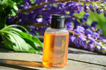 organic cosmetic with lavender flowers and oil on white background