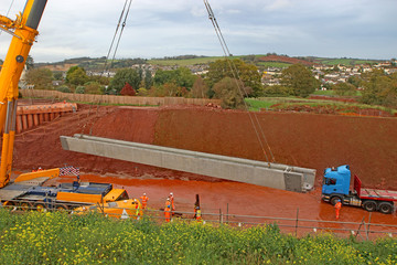 Crane lifting a bridge beam