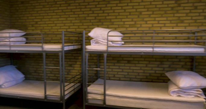 High Quality footage of a sleeping room filled with bunk beds. Filmed in 4K