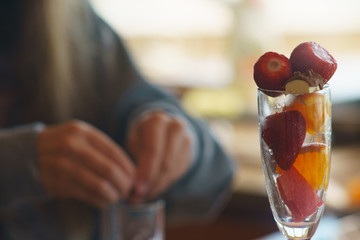 Fruits in the glass. Image with defocused background.