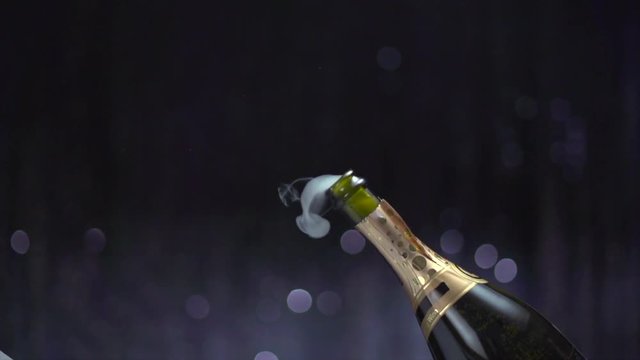Champagne explosion. Sparkling wine popping, opening champagne bottle closeup. Slow motion. 4K UHD video footage. 3840X2160