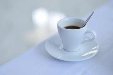 coffee cup on white desk table