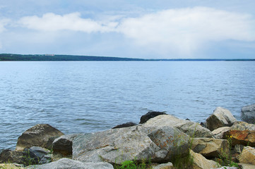Large stones on the seashore. Sea landscape.