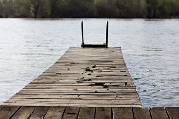 Fototapeta premium Wooden bridge, pier near the river