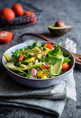Keuken spatwand met foto Healthy arugula salad with avocado, radish, bell pepper, tomato and Roquefort cheese © noirchocolate