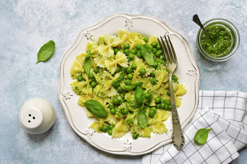 Farfalle pasta with pesto sauce and green pea.Top view.