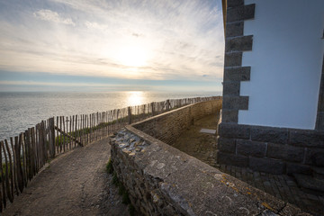 Fototapeta premium Lighthouse and ruin of monastery, Pointe de Saint Mathieu, Brittany (Bretagne), France