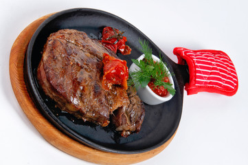 Meat steak with cherry tomatoes and sauce