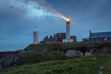 Fototapeta na wymiar Lighthouse and ruin of monastery, Pointe de Saint Mathieu, Brittany (Bretagne), France