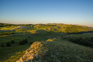 Morning Green Mountain Hills under Blue Sky of Dawn Landscape Background